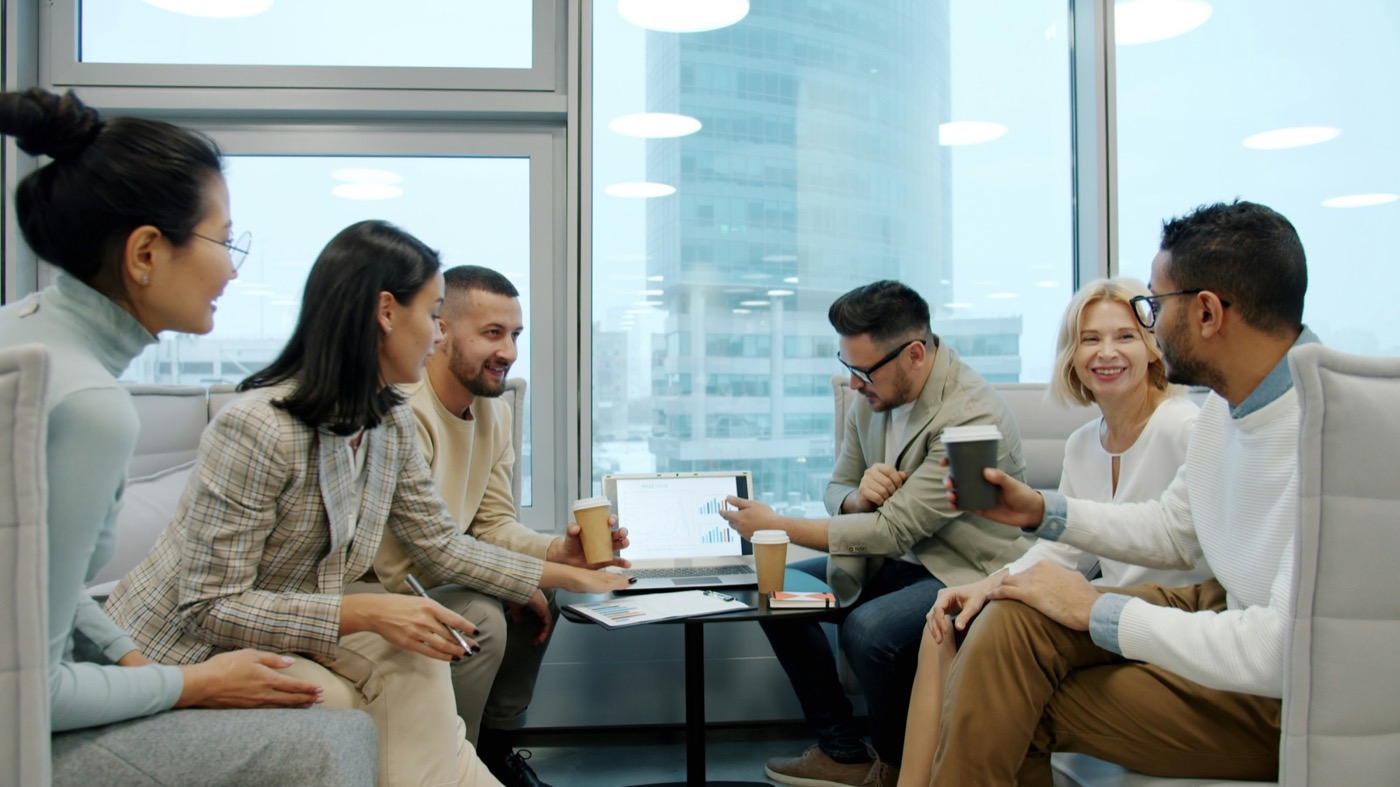 Nonprofit leaders in a relaxed discussion with a consultant